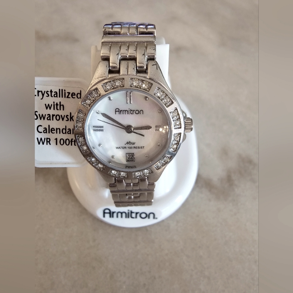 Woman's slim stainless steel watch, mother of pearl face